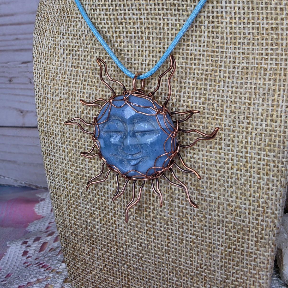 Copper-Wrapped Carved Plum Agate Pendant