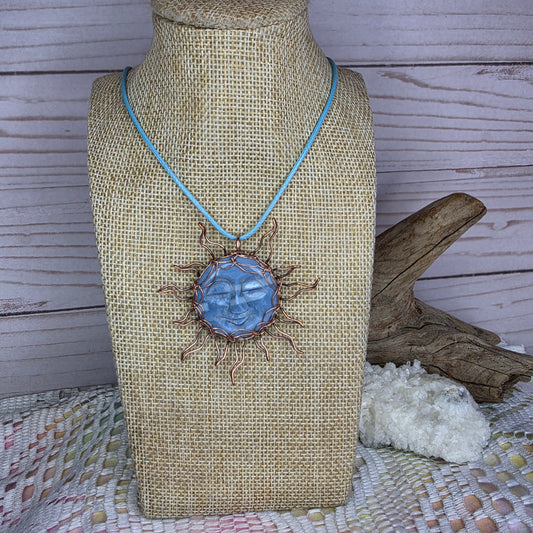 Copper-Wrapped Carved Plum Agate Pendant